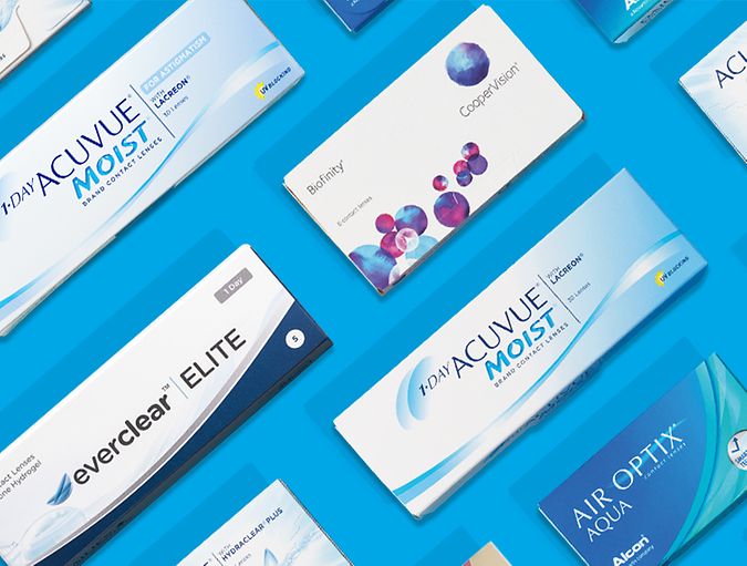 Several contact lens boxes on a blue background.
